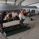 Contract workers load a Hellfire missile onto a U.S. Air Force MQ-1B Predator unmanned aerial vehicle (UAV), at a secret air base in the Persian Gulf region on January 7, 2016.